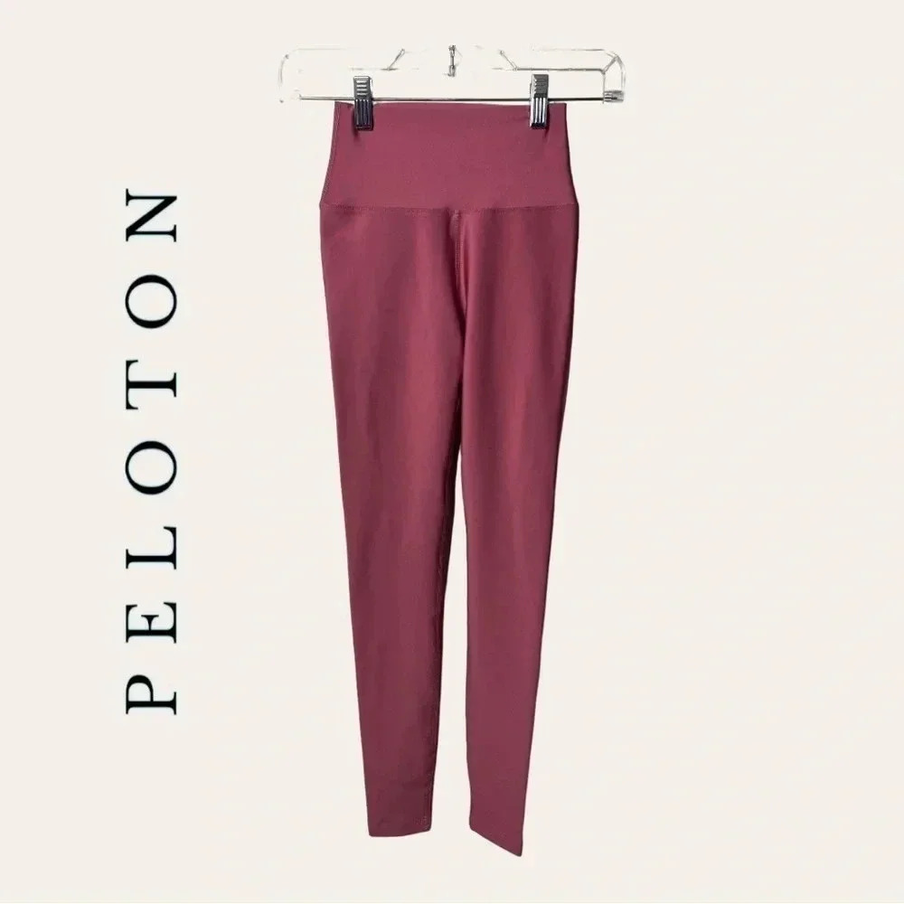 1169. Peloton SOLID FLEX LEGGINGS SIZE XSMALL PINK IN COLOR W/ WHITE PRINT DOWN